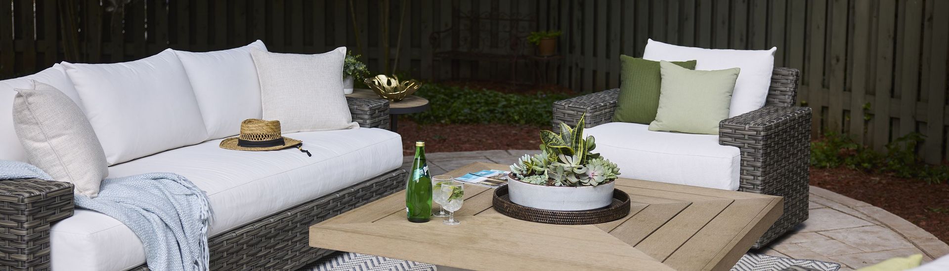 A set of outdoor furniture in a garden scene